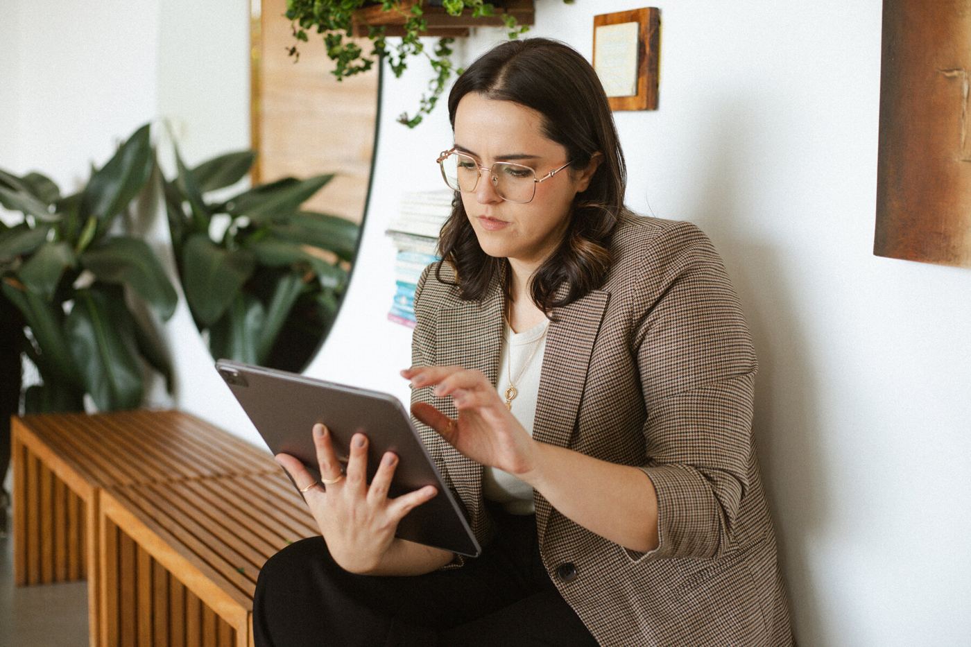 Lili Chiacchio reviewing a firm's setup on a tablet